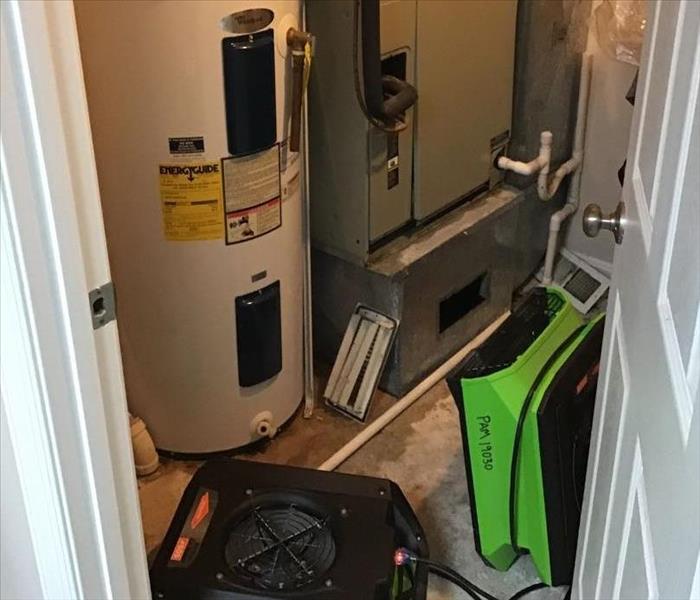 water damage in utility closet