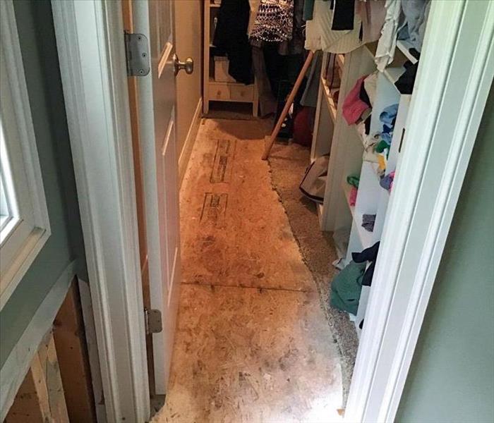Closet carpet ripped out after water damage