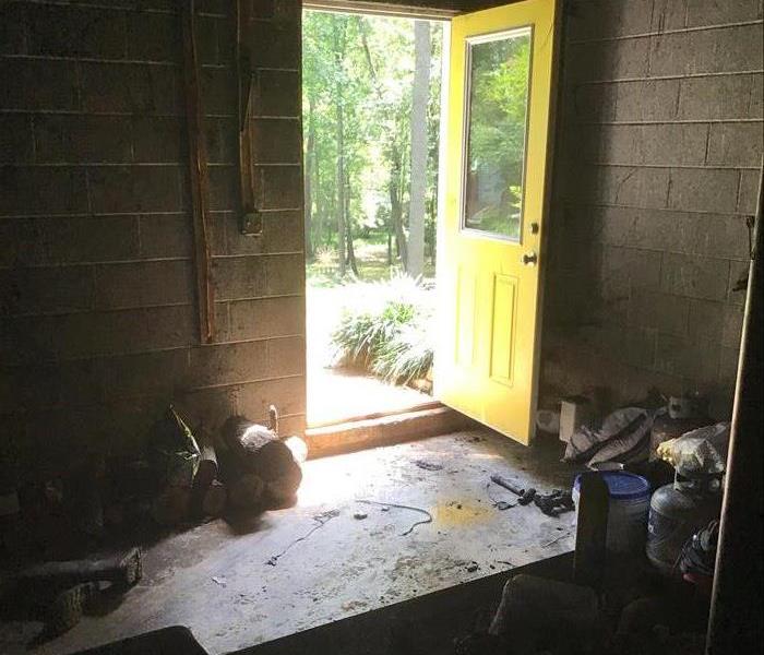 an open door during water damage cleanup and restoration 