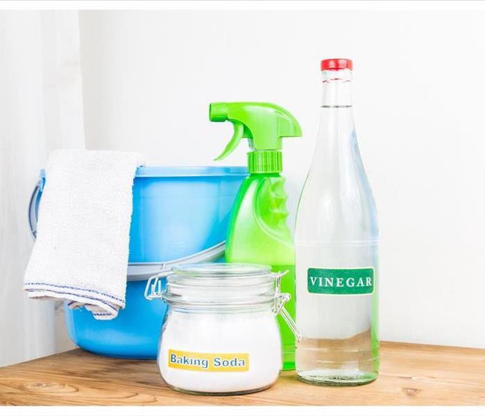 baking soda and vinegar with cleaning tools 