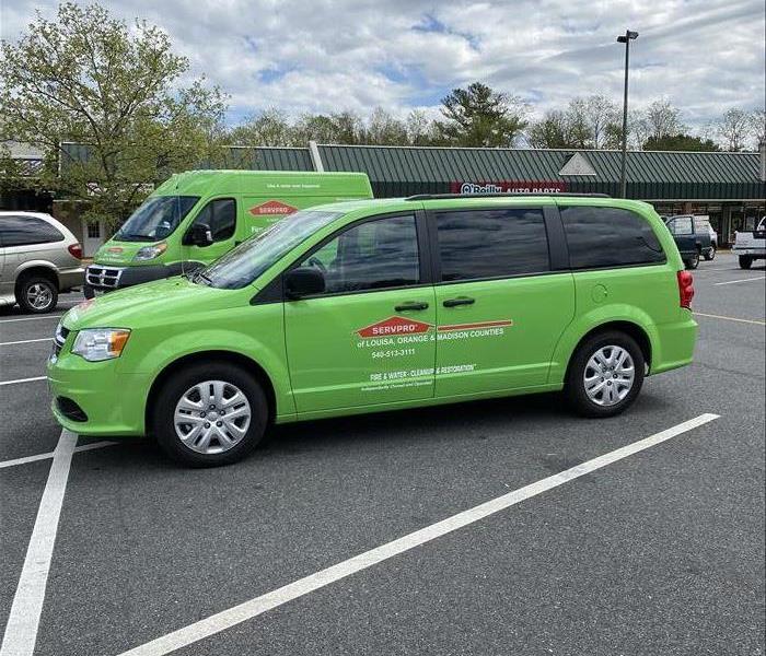 Dodge caravan painted SERVPRO green with franchise lettering